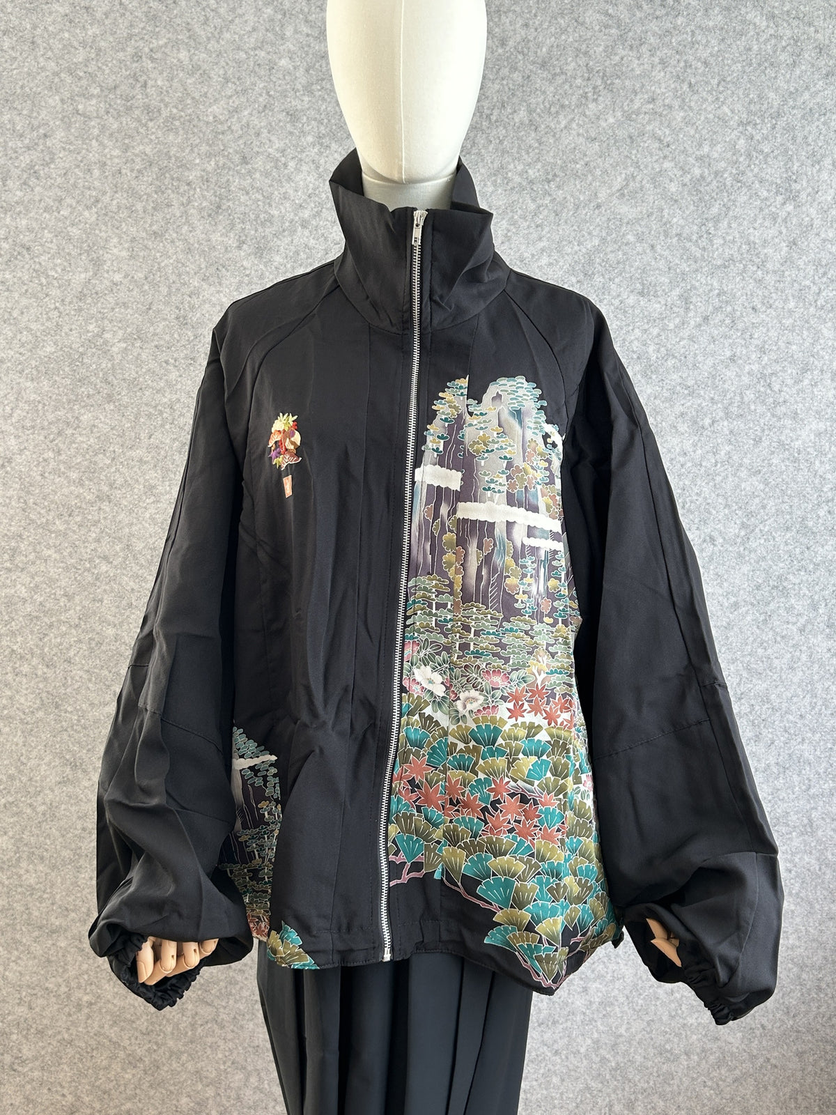 Black high collar kimono jacket with landscape scene, front view