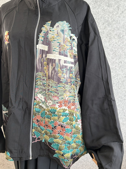 Black high collar kimono jacket with landscape scene, closer front view