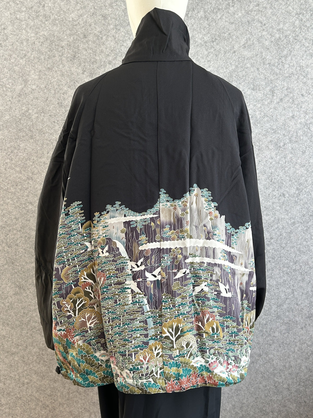 Black high collar kimono jacket with landscape scene, back view