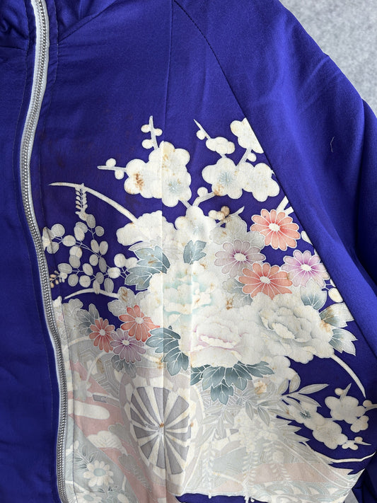 Purple kimono jacket, detail of white and coral flowers beside the zipper