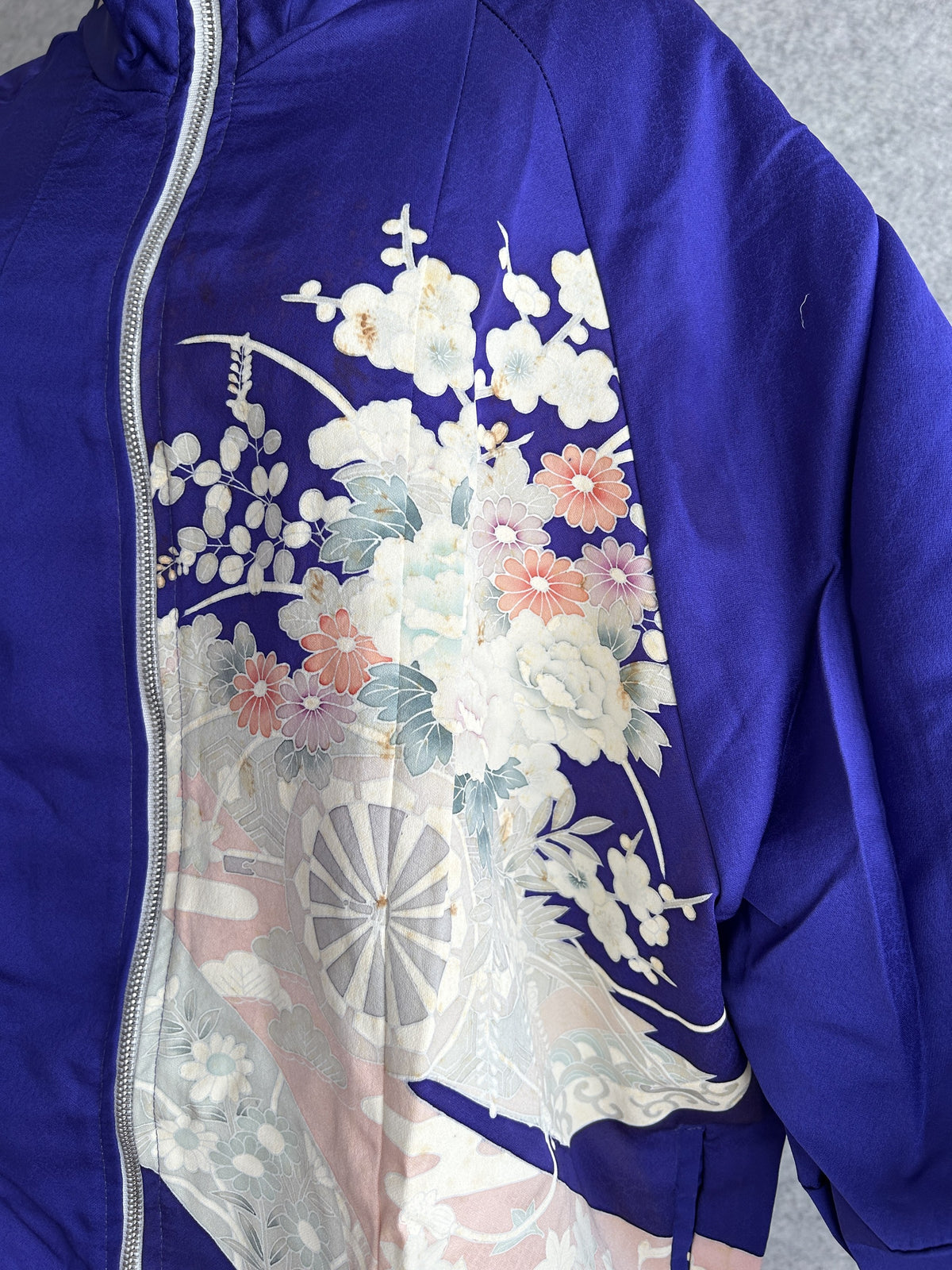 Purple kimono jacket, close-up of front floral panel with wheel motif