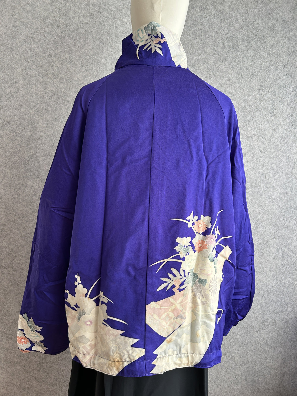 Purple high collar kimono jacket with floral hem design, back view