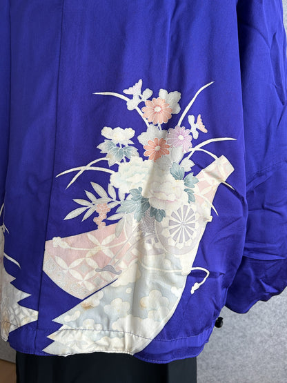 Purple kimono jacket, detail of flower bouquet motif on the back hem