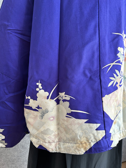 Purple kimono jacket, detail of cream patterned hem and side seam