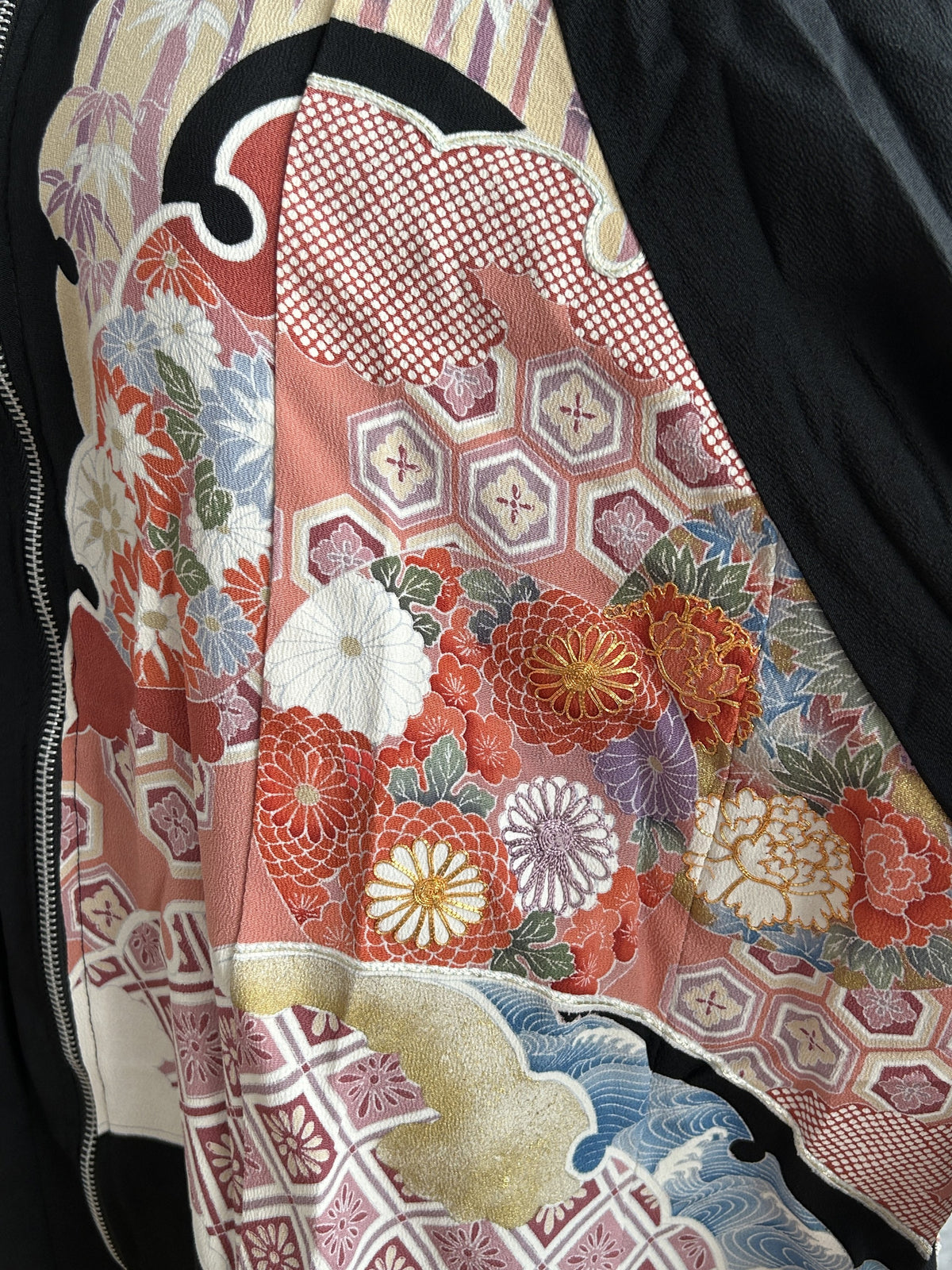 Black kimono jacket, close-up of red and white chrysanthemums on front