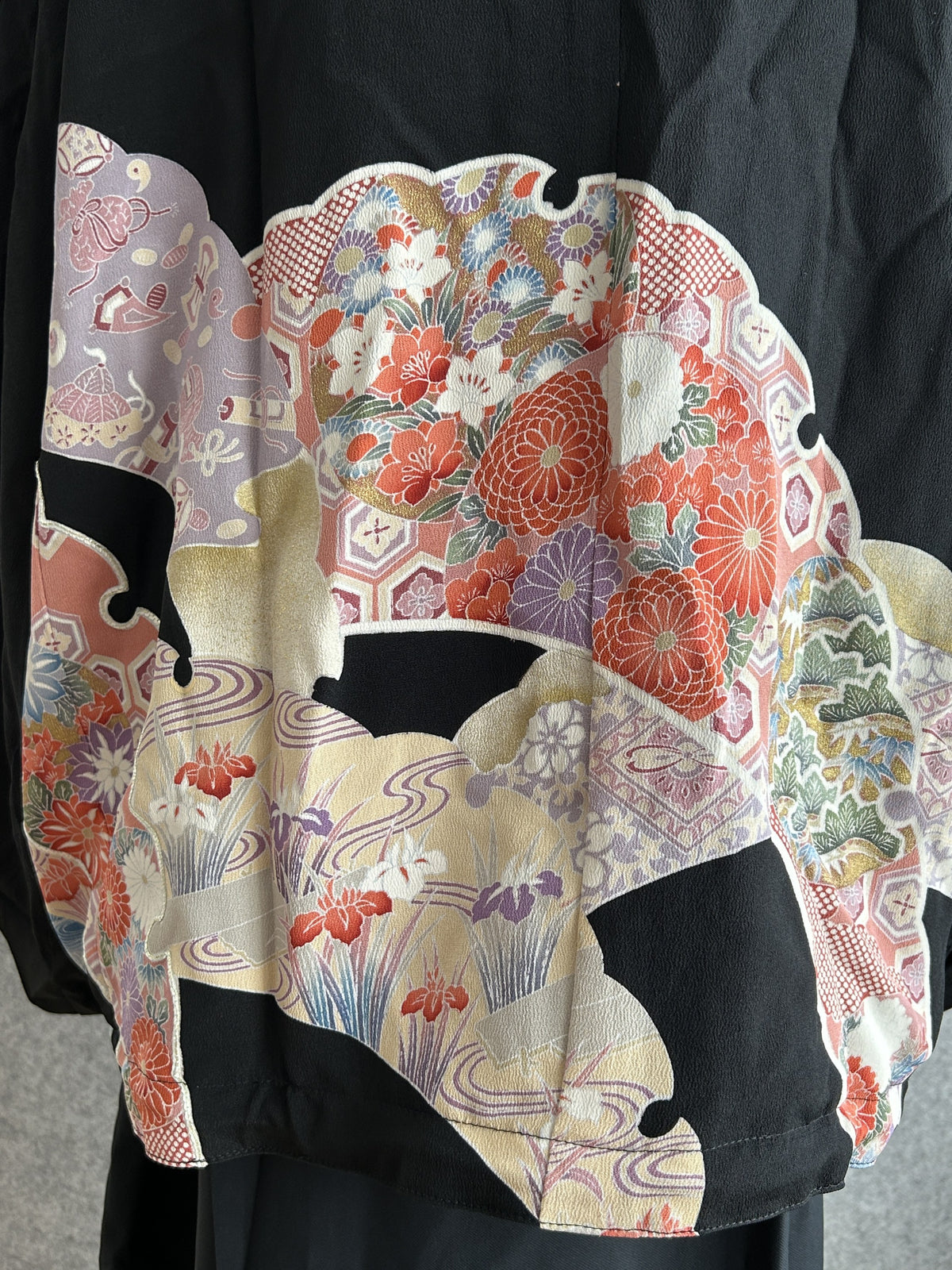 Black kimono jacket, close-up of floral and geometric back panel
