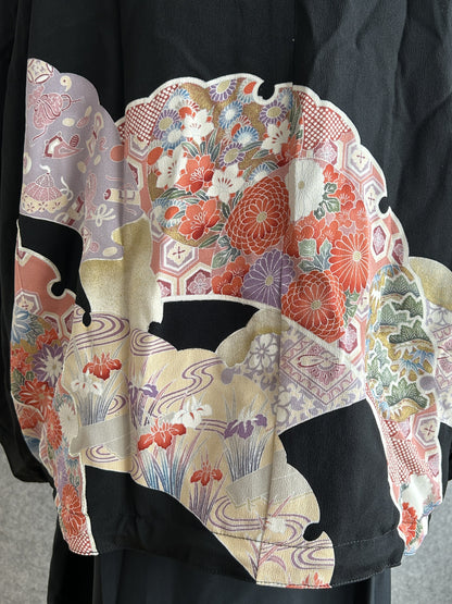Black kimono jacket, close-up of floral and geometric back panel