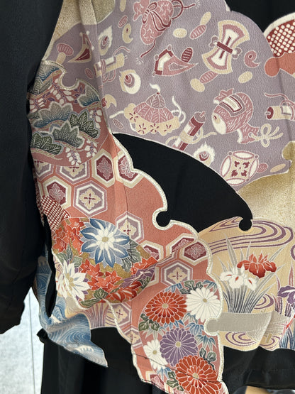Black kimono jacket, detail of lilac panel with small objects pattern