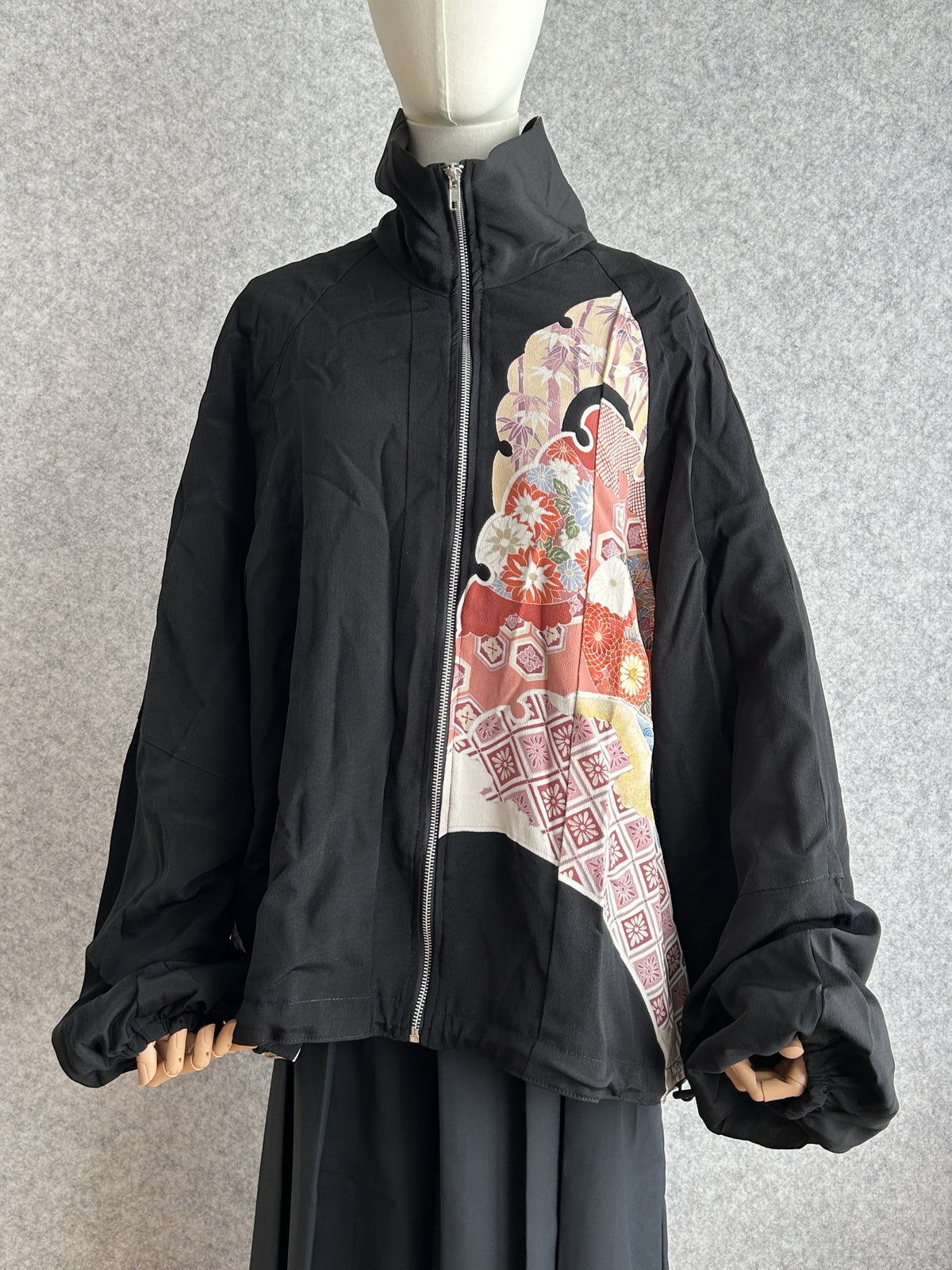Black high collar kimono jacket with floral panel, front view arms out