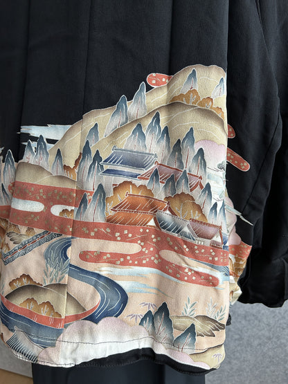 Black kimono jacket, close-up of back landscape with river and mountains