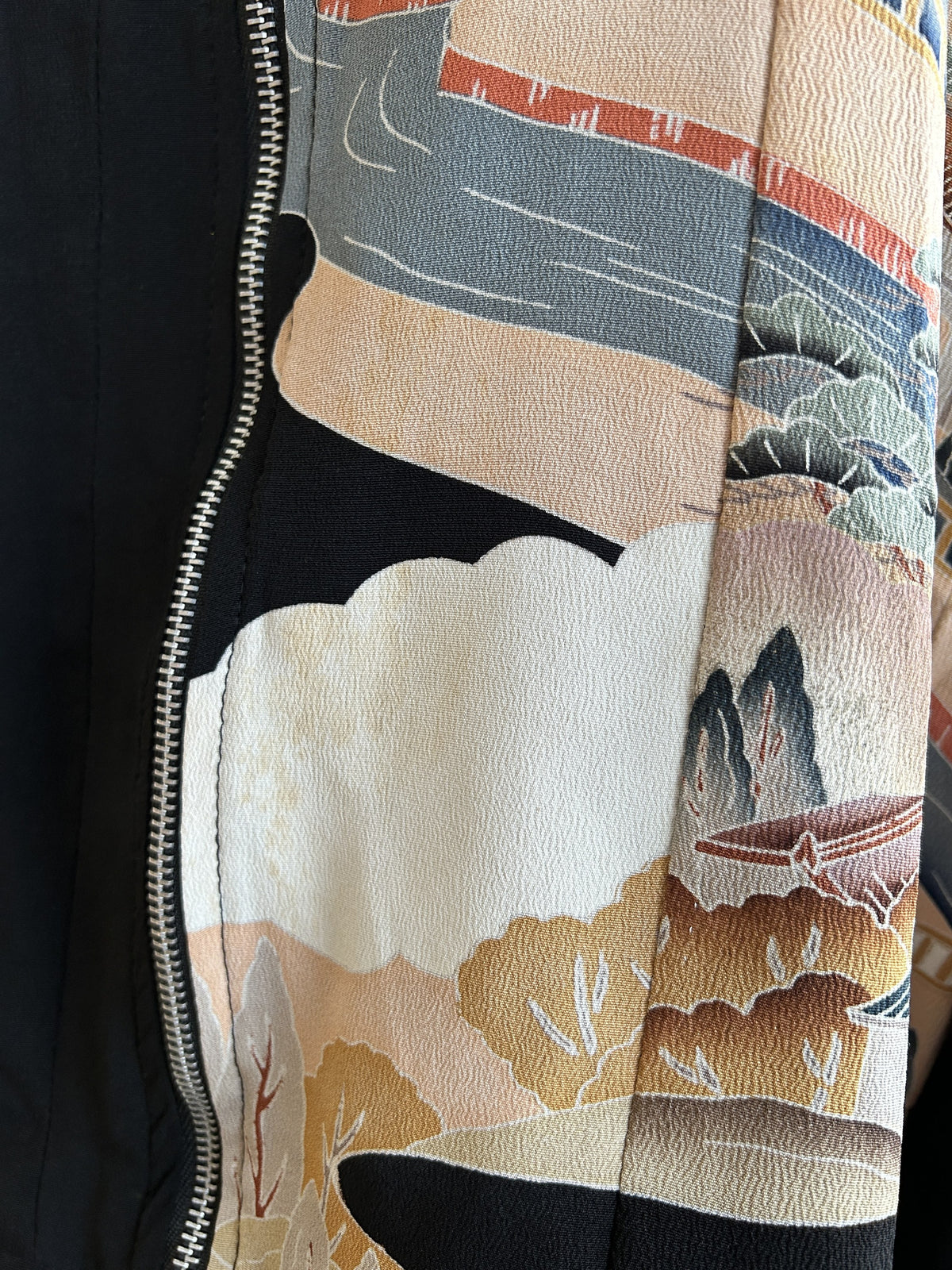 Black kimono jacket, close-up of white cloud and mountain motif on front
