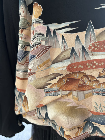 Black kimono jacket, detail of landscape scene at side hem