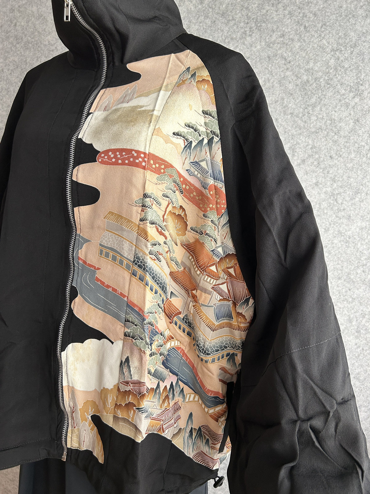 Black kimono jacket, detail of front landscape panel and wide sleeve