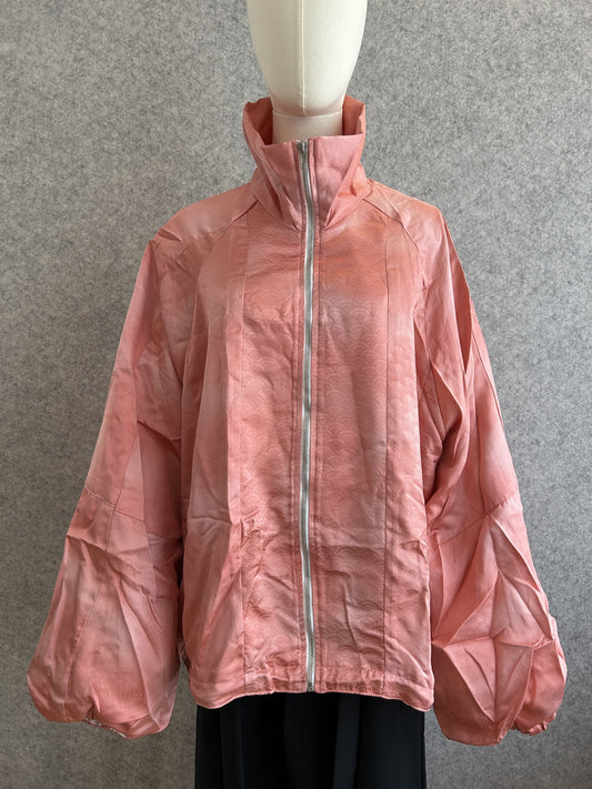 Pink high collar kimono jacket with subtle woven pattern, front view