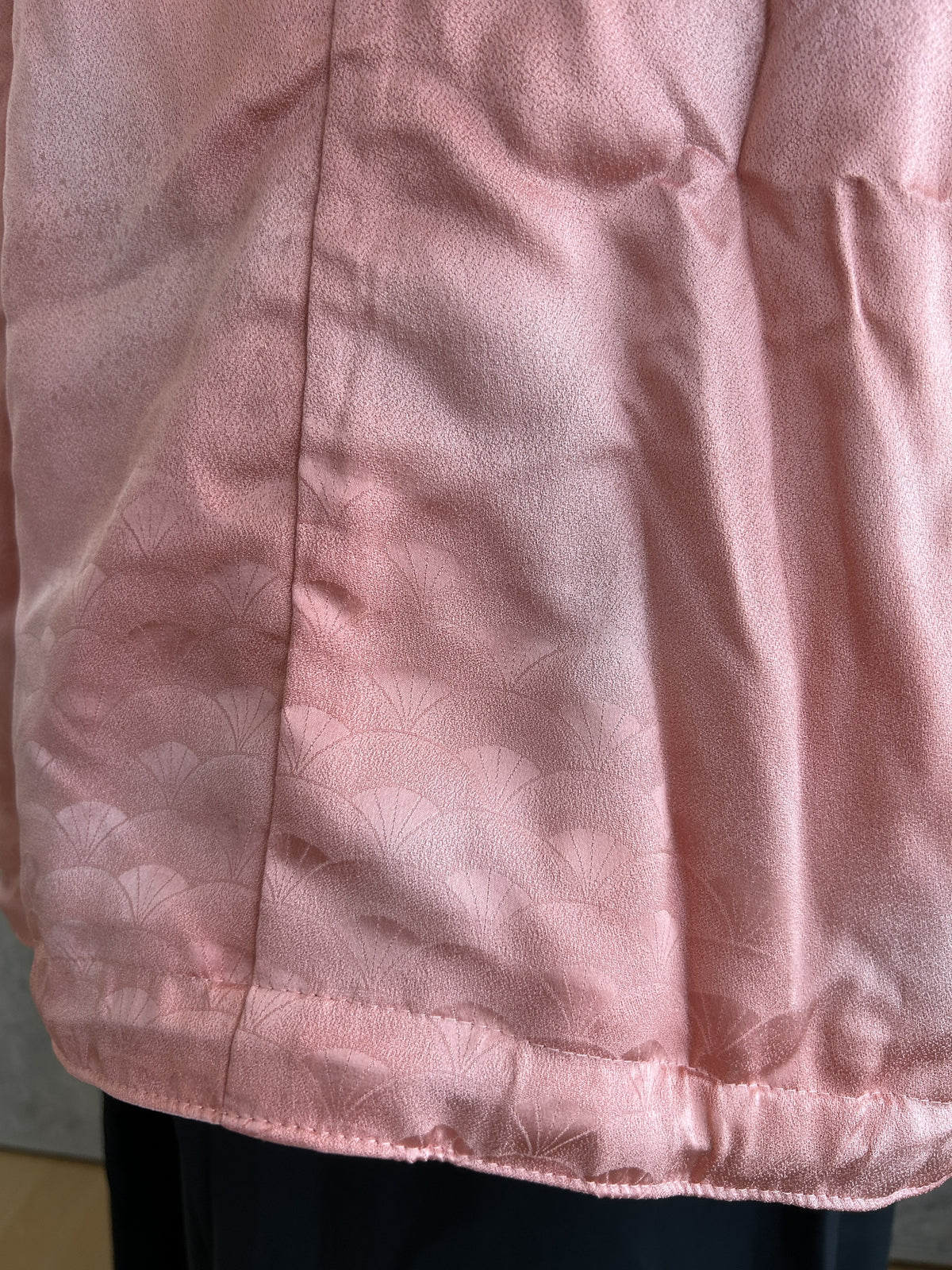 Pink kimono jacket, detail of elasticated hem and woven fan pattern