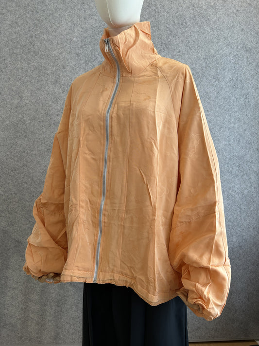 Light orange high collar kimono jacket with subtle cloud pattern, front view