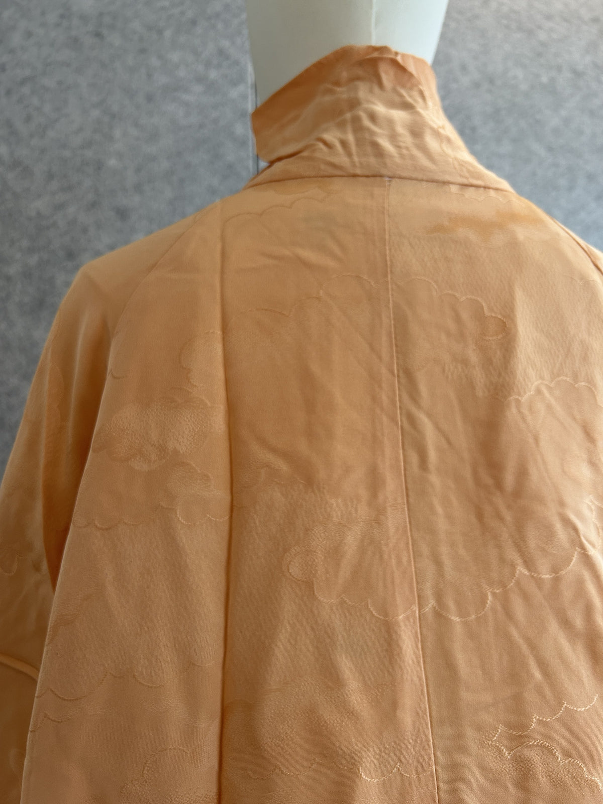 Light orange kimono jacket, close-up of woven cloud pattern on back