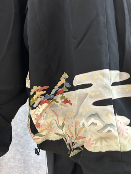 Black kimono jacket, detail of sleeve with cream cloud and pine motif