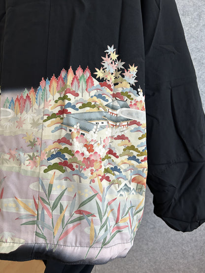 Black kimono jacket, close-up of back landscape with building and trees