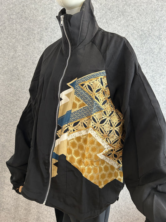 Black high collar kimono jacket with gold geometric panel, front side view