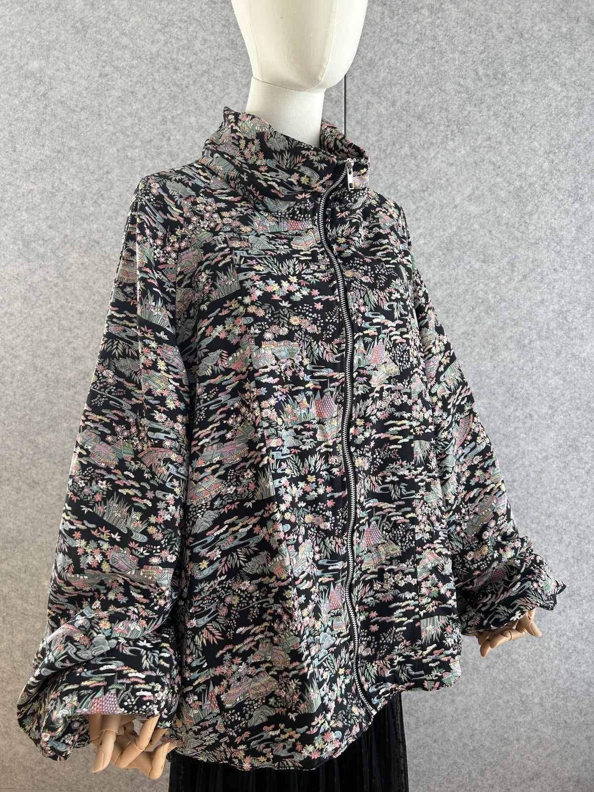 Black high collar kimono jacket with pastel all-over pattern, front side view