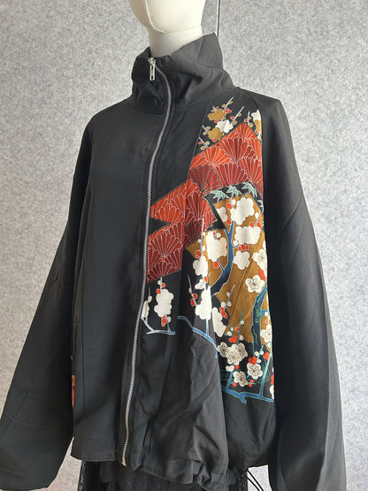 Black high collar kimono jacket with red and gold floral panel, front view