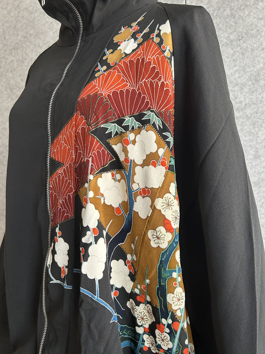 Black kimono jacket, close-up of white plum blossoms on gold front panel