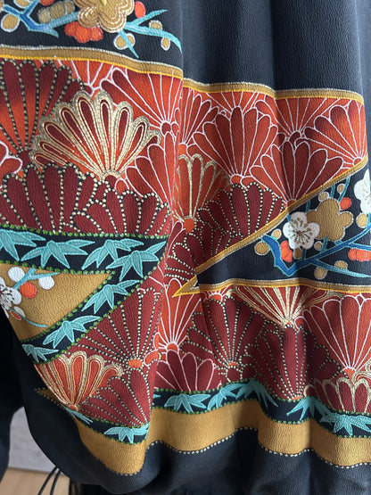 Black kimono jacket, close-up of red pine pattern with gold outlines