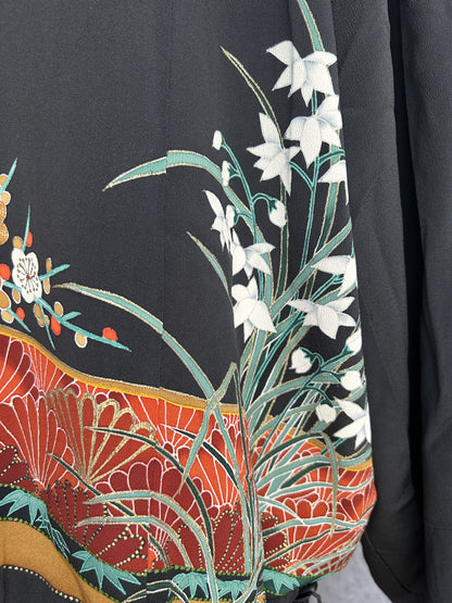 Black kimono jacket, close-up of white flowers with green leaves on back