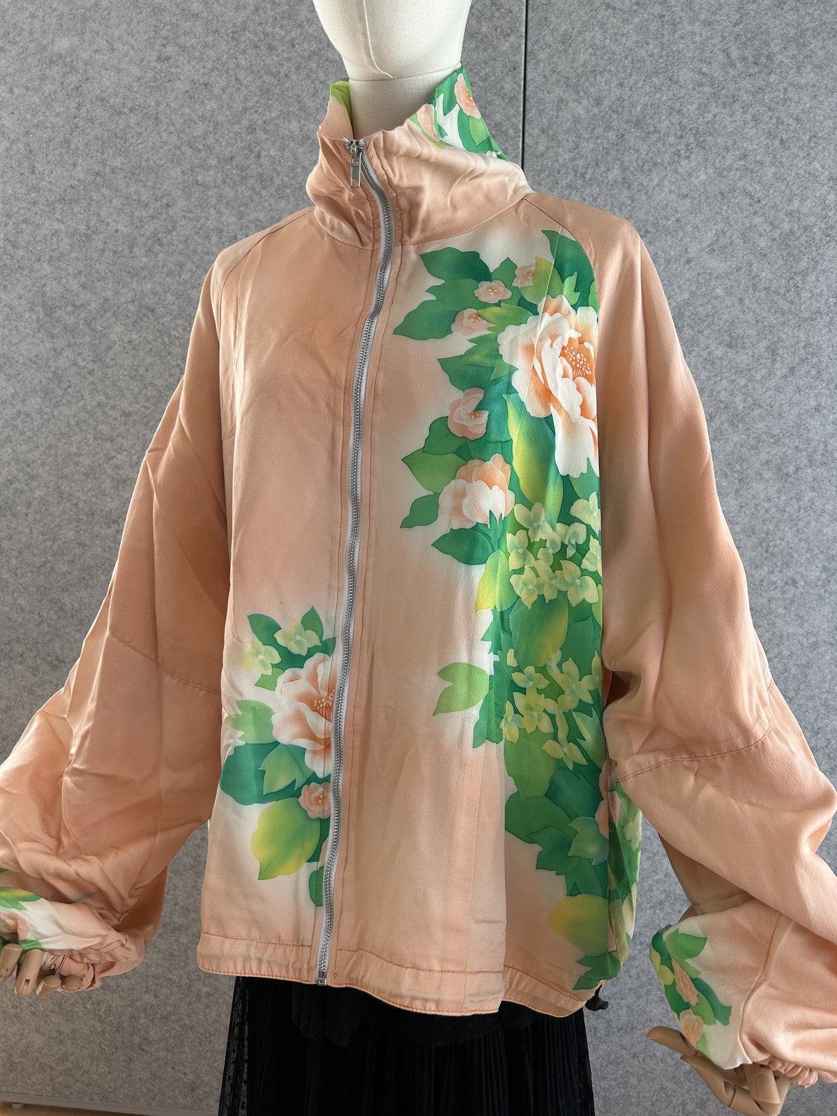 Peach high collar kimono jacket with large green floral design, front view