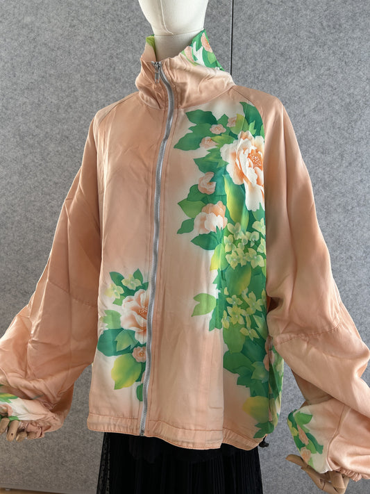 Peach high collar kimono jacket with large green floral design, front view