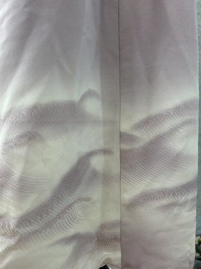 Detail of stitched lilac and white waves on ivory kimono silk