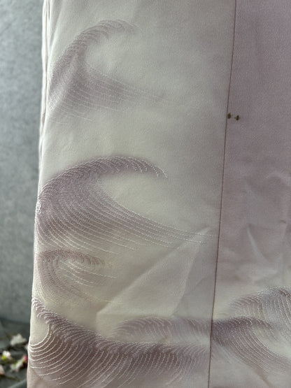 Close-up of stitched wave motif on lilac kimono silk