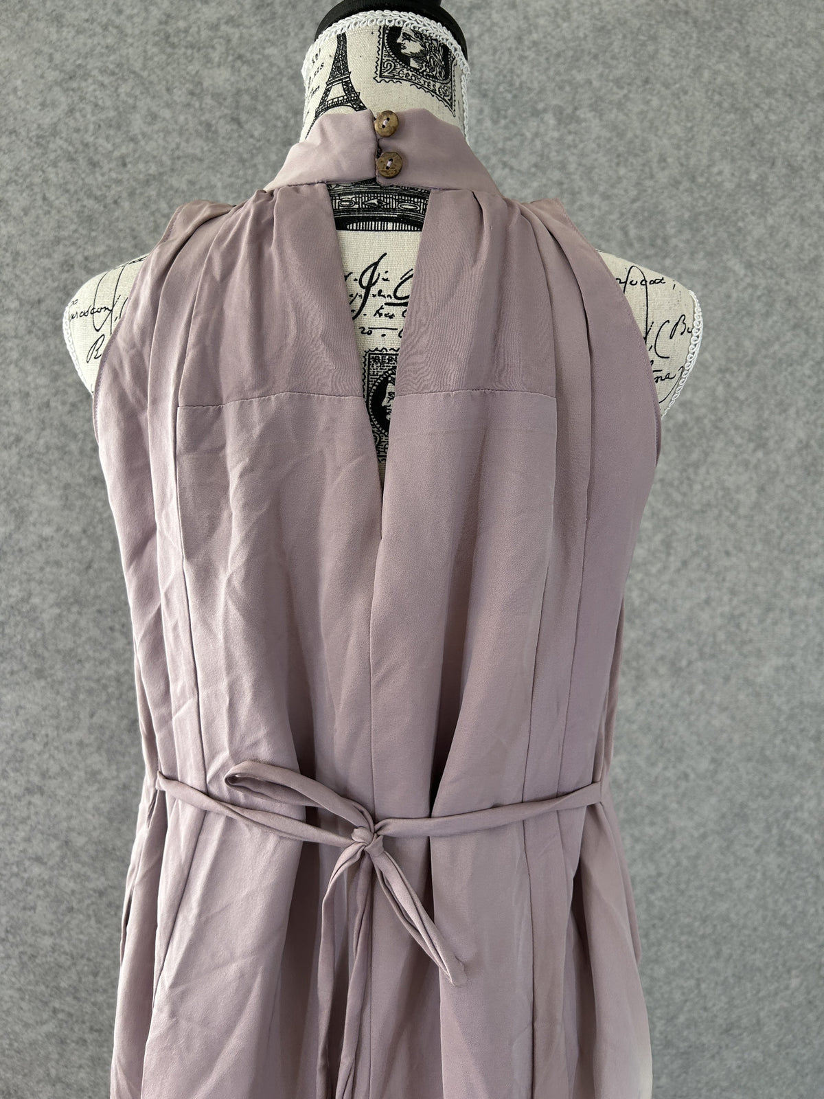 Back of lilac kimono halter dress, button collar and open back detail