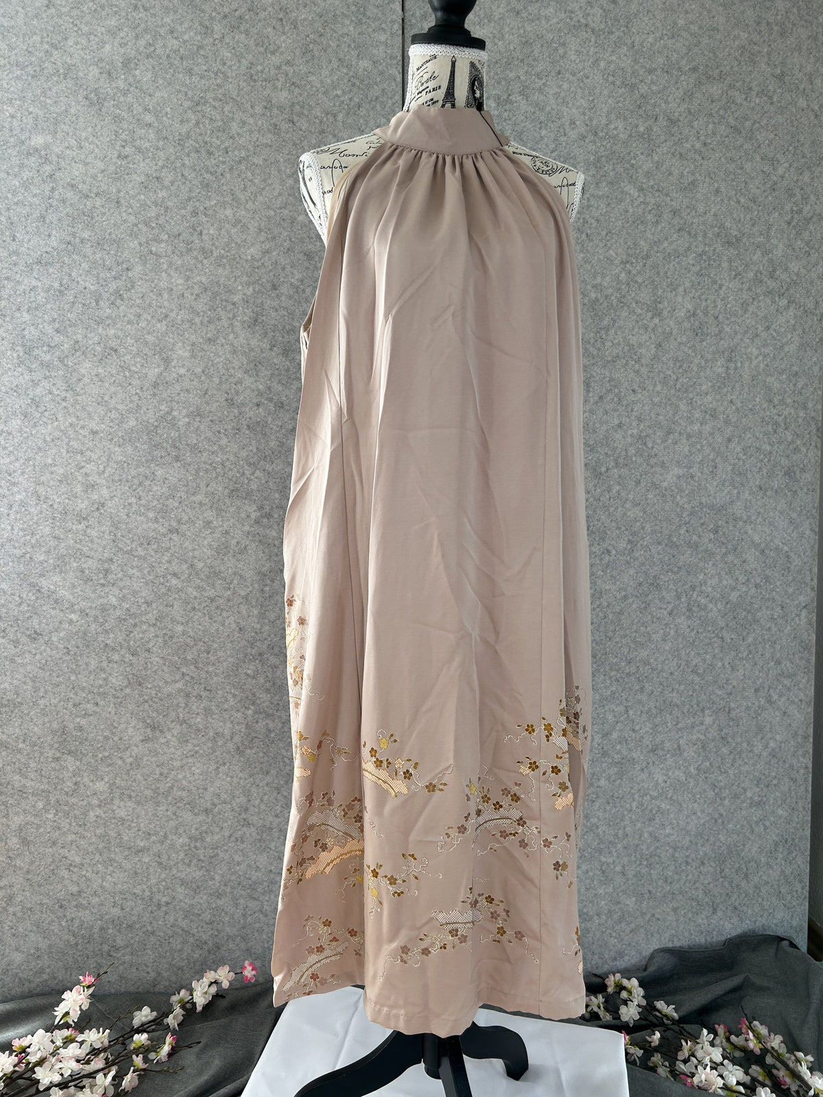 Beige kimono halter dress with embroidered blossoms at the hem, front view