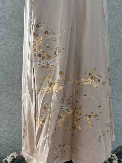 Lower skirt of beige kimono dress with embroidered flower sprays