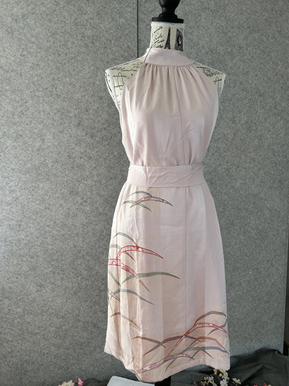 Light pink kimono halter dress belted with sash, front view