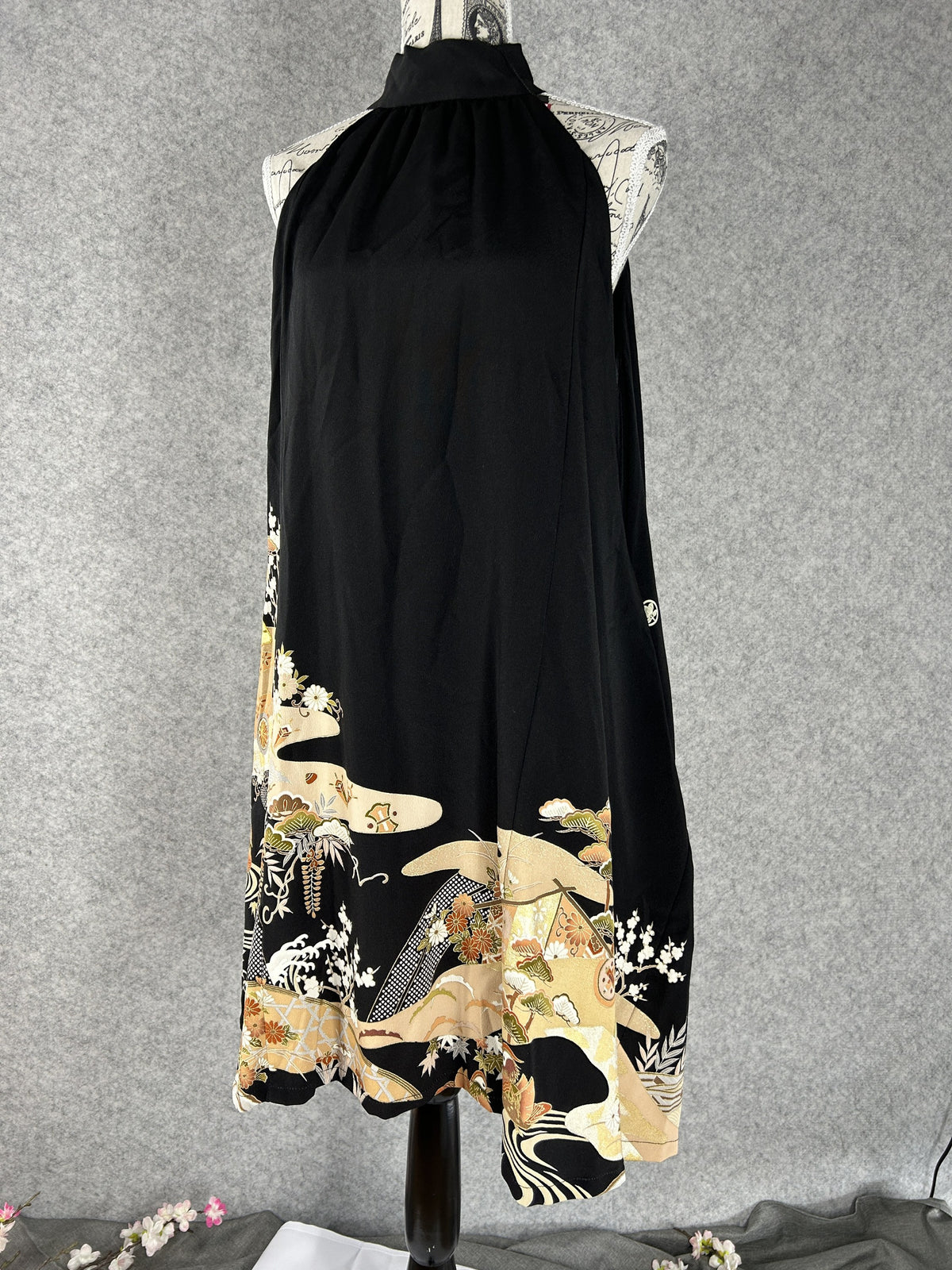 Black kimono halter dress with gold and cream scenic hem, front view