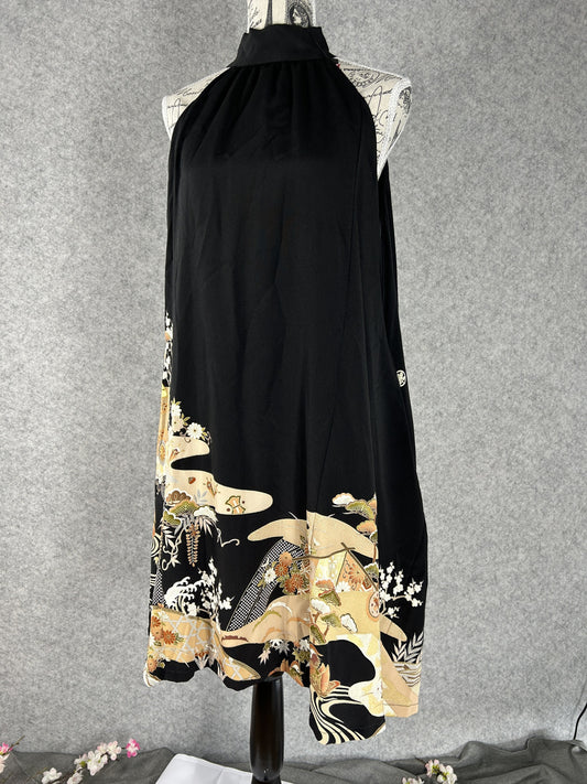 Black kimono halter dress with gold and cream scenic hem, front view