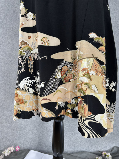 Gold clouds, waves and mandarin duck on the hem of black kimono dress