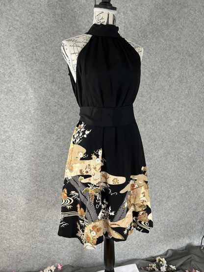 Black kimono halter dress with matching sash and scenic hem, front view