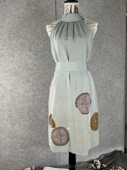 Sage green kimono halter dress with matching sash at the waist, front view