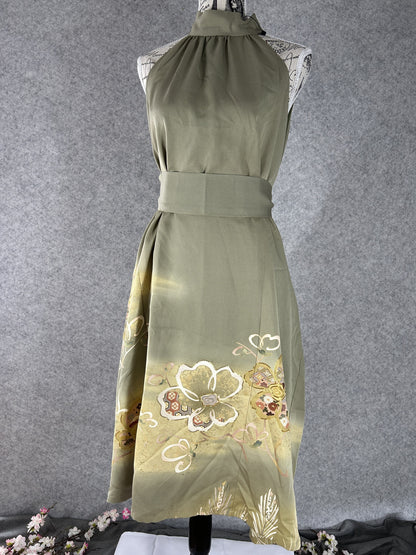 Sage green kimono halter dress worn with matching sash belt, front view