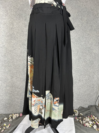 Black upcycled tomesode kimono hakama pants with a gold phoenix and fans, front view