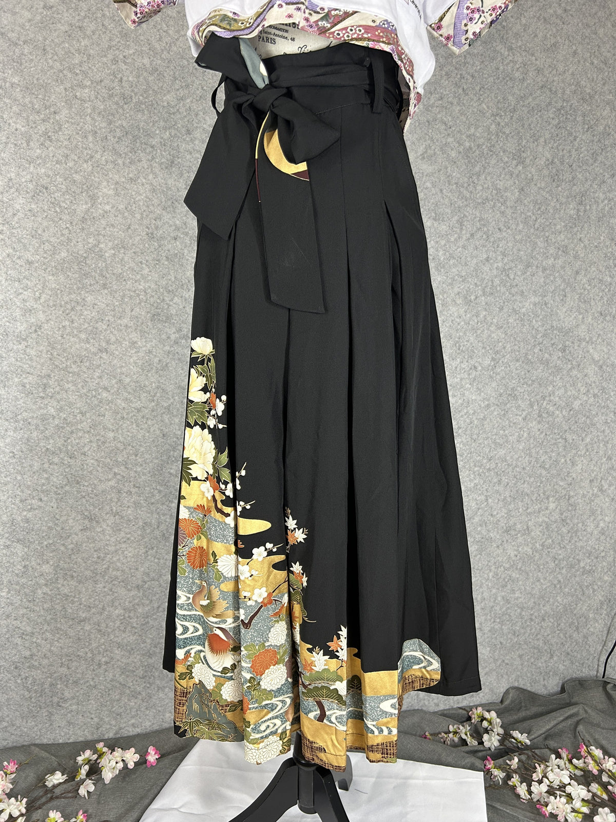 Black upcycled tomesode kimono hakama pants with mandarin ducks and peonies, front view with bow tie