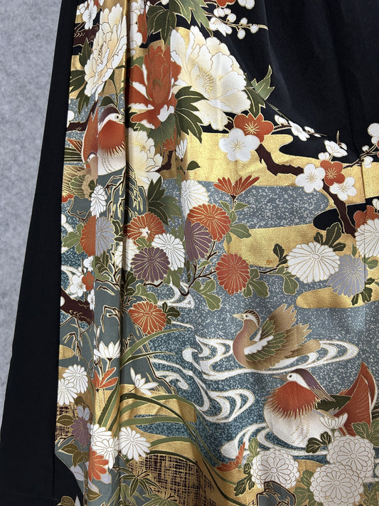 Black upcycled tomesode kimono hakama pants with mandarin ducks and peonies, detail of the mandarin ducks and peonies