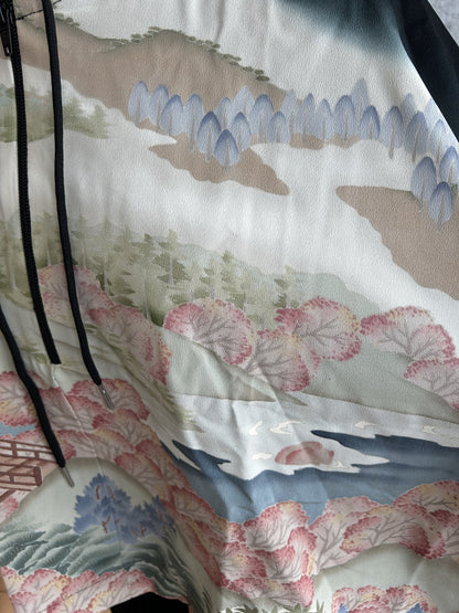 Black and cream hooded kimono poncho, detail of hills and river