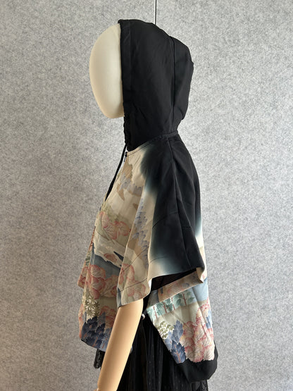 Black and cream hooded kimono poncho with landscape scene, side view