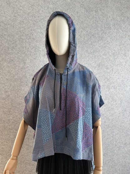 Blue hooded kimono poncho with patchwork of small patterns, front view