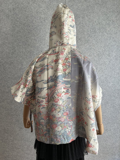Cream hooded kimono poncho with red and blue floral scene, back view